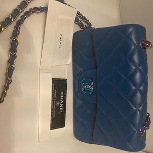 Chanel blue bag with iridescent hardware detail and fuchsia interior